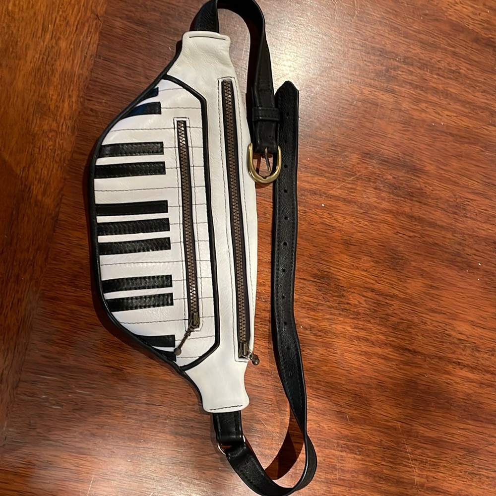 Leather cross body bag. Piano key detail. Leather